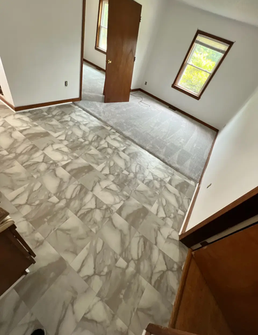 Triangle Flooring - Kitchen tile floor installation with transition to carpet