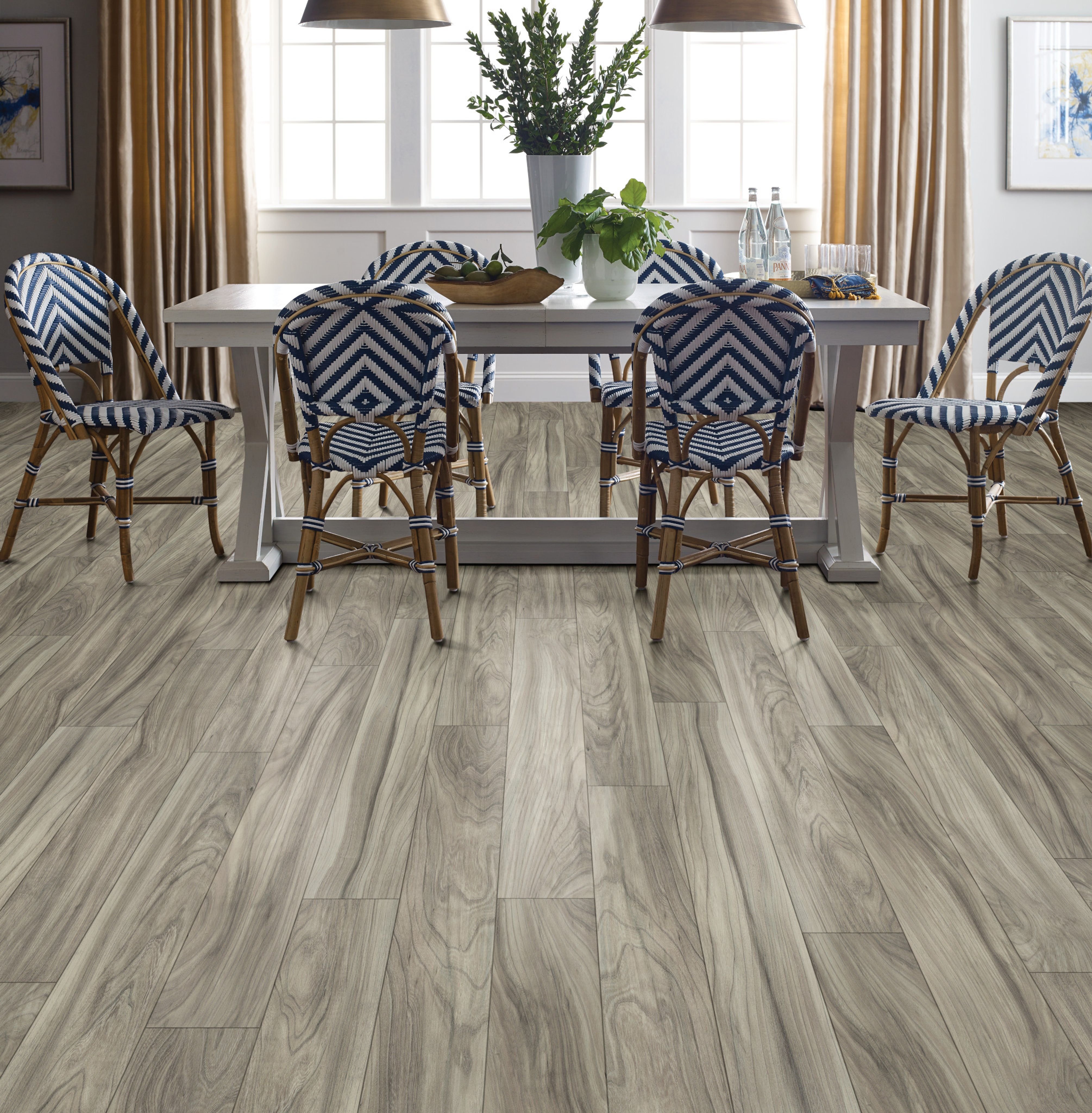 Dining room with blue and white chairs and wood-look repel laminate flooring from Triangle Flooring Center in Carrboro, North Carolina