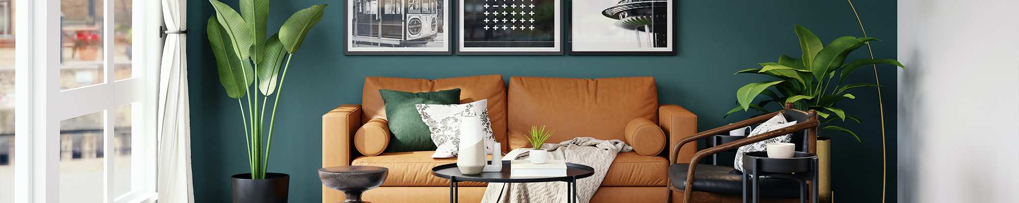 living room with orange couch and houseplants with pictures on the wall from Triangle Flooring Center in Carrboro, North Carolina